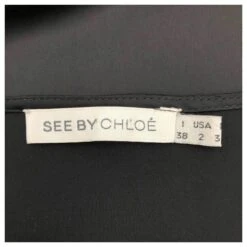 Robe Droite See By Chloé En Satin Noir Avec Manches En Jersey Et épaules Manquantes -ModeChic Magasin 593132 5